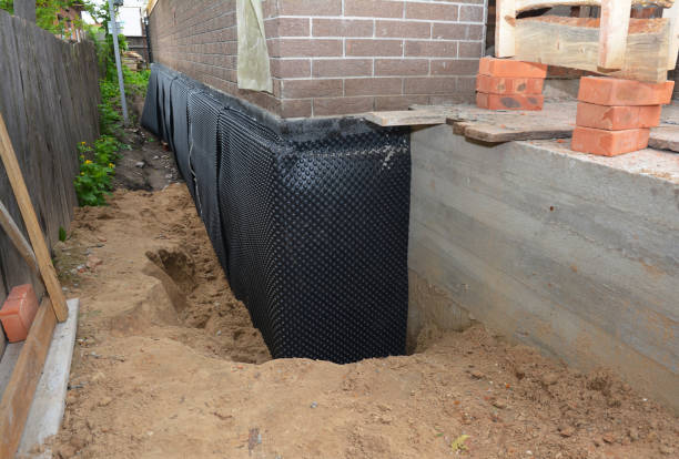 SJ Waterproofing Pros technician performing targeted Wet Basement Repair assessment in Deer Park, OH